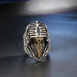 Retro gothic skull ring featuring a golden raven beak skull and bionic rib cage design