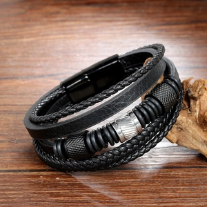 Men's multilayer black braided leather bracelet with stainless steel beads on wood