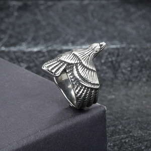 Detailed macro view of vintage eagle ring with intricate feather texture and oxidized finish