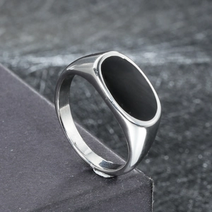 Polished silver signet ring with oval black inlay, sleek minimalist jewelry for men