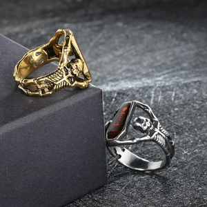 Macro view of Gothic skeleton rings with coffin design and red center stones