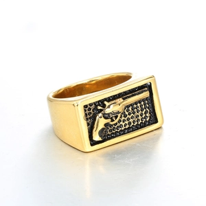 Vintage gold stainless steel signet ring with black honeycomb pattern and revolver relief
