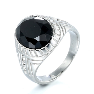 Macro shot of silver stainless steel ring featuring a large faceted black gemstone inlay