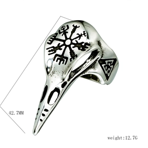 Detail view of a vintage bird skull ring in stainless steel with Viking compass symbols