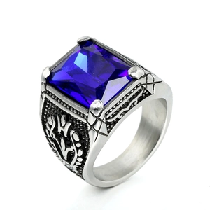 Vintage stainless steel ring featuring a large emerald-cut blue gemstone and engraved band