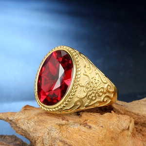 Vintage stainless steel ring featuring a large oval red ruby stone on natural bark