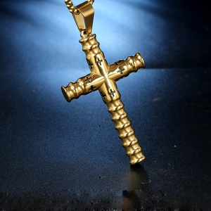Golden stainless steel cross necklace with bamboo texture and black engraved crosses