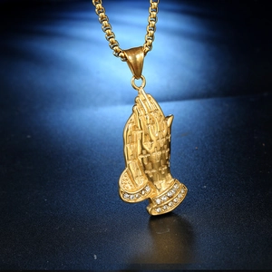 Golden praying hands pendant necklace with cross detail and crystals on box chain