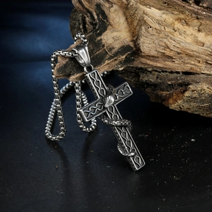 Gothic stainless steel necklace with a snake wrapped around a vintage cross pendant