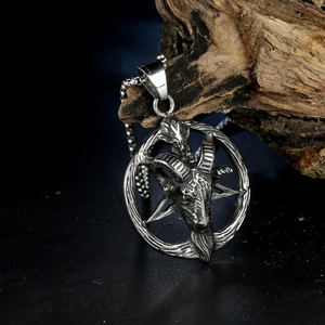 Gothic punk Baphomet ram head pendant necklace in stainless steel on dark wood