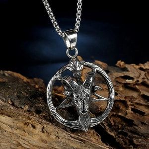 Vintage stainless steel ram head pendant necklace with pentagram on a rustic wood stand