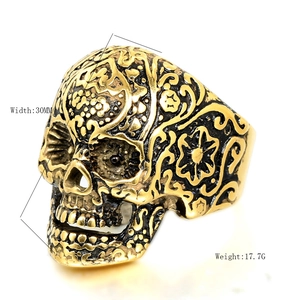 Men's vintage skull ring with antique gold finish and 30mm floral engraved biker design