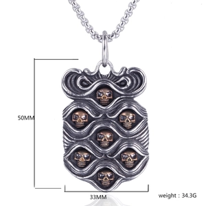 Detail view of punk skull shield pendant showing dimensions 50MM by 33MM with weight info