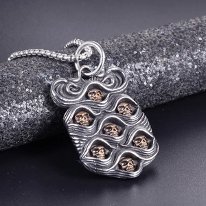 Punk style stainless steel skull pendant necklace with silver wavy texture and gold accents