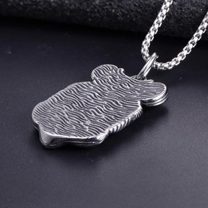 Punk style stainless steel skull pendant with textured finish and classic box chain necklace