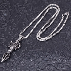 Vintage stainless steel necklace featuring a Vajra and deity pendant on a box chain
