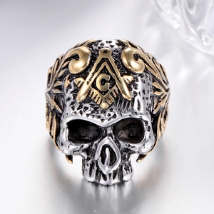 Macro view of gothic skull ring showing Masonic symbol and gold leaf detailing