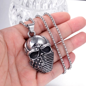 Detailed punk skull pendant in stainless steel featuring vintage flag patterns on a box chain