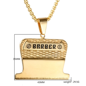 Detailed close-up of golden barber clipper pendant with 35mm and 43mm scale measurements