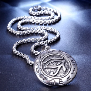 Detail of Eye of Horus stainless steel pendant with vintage engravings and box chain