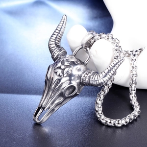 Vintage stainless steel bull skull pendant necklace with intricate cross relief carvings