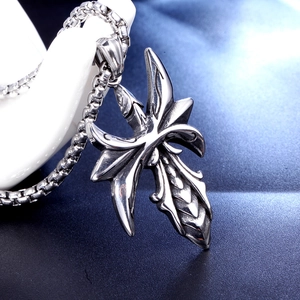 Gothic stainless steel cross pendant necklace with box chain for men on a display hand