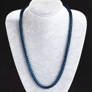 Polished blue titanium steel wheat chain necklace displayed on a jewelry bust