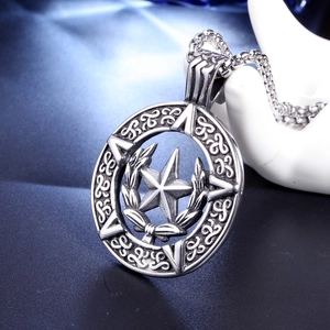 Macro shot of silver hip hop hexagram pendant with intricate celtic patterns