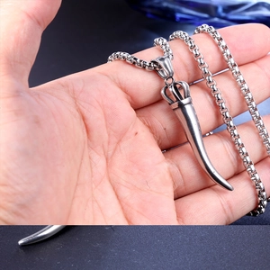 Polished silver horn pendant necklace with crown detail and classic box chain for women