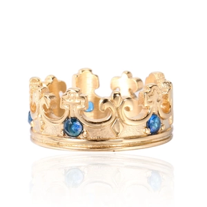 Gothic crown ring in gold steel with blue sapphire accents and ornate cross pattern