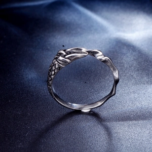 Gothic style stainless steel ring featuring snake scale texture and organic wave patterns