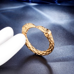 Vintage golden animal snake ring with embossed scale texture in retro punk style