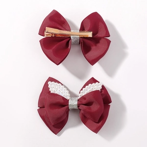 Set of two burgundy grosgrain bow hair clips with glitter accents and white faux pearls