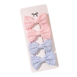 Set of 4 cute plaid bow hair clips for girls featuring pink and blue gingham patterns