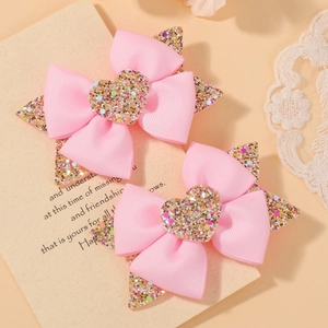 Lot de barrettes à cheveux roses avec nœuds et détails de cœur et étoile pailletés
