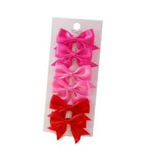 Set of 6 mini solid color satin bow hair clips for girls in deep pink and red shades