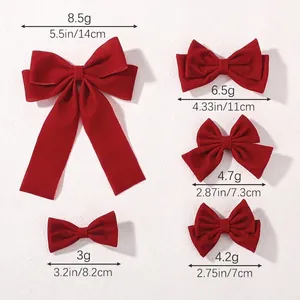 Red velvet bow hair clips in five sizes showing weights and lengths for women