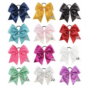 Set of 12 large sequin bow hair ties with elastic bands in various vibrant colors