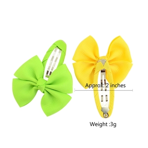 Fluorescent green and bright yellow 2-inch grosgrain ribbon bow clips for children