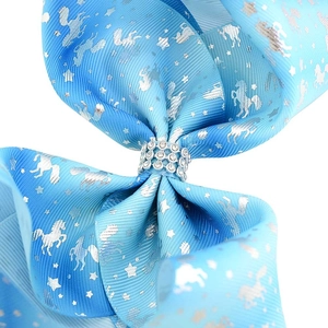 Light blue unicorn hair bow with silver foil prints and sparkling rhinestone center