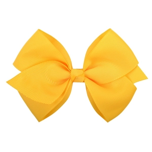 Detailed macro view of bright yellow grosgrain ribbon bow clip with ribbed texture