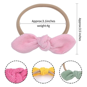Pink nylon baby headband with corduroy bow detail and multiple color options