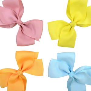 Set of four grosgrain ribbon hair bows in pink, yellow, orange and blue for girls
