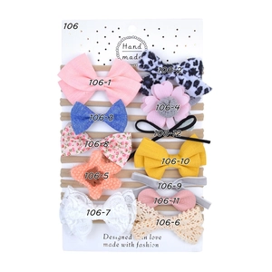 Set of 12 soft cotton baby headbands featuring colorful bows and floral patterns