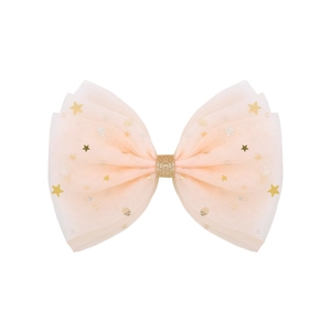 Detail of apricot tulle bow hair clip featuring gold stars and shimmering sequins