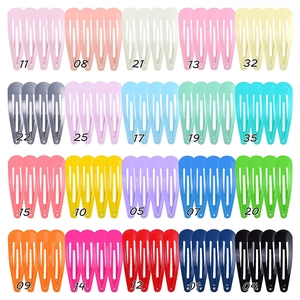 Flat lay of 20 colors colorful drop metal BB hair clips set with smooth lacquer finish