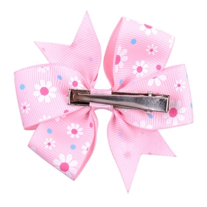 Pink grosgrain ribbon hair clip with white daisy print and silver metal duckbill clip