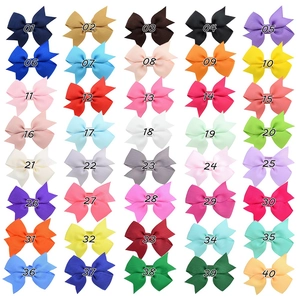 Detailed catalog showing 40 colorful grosgrain ribbon bow clips for girls hair styling