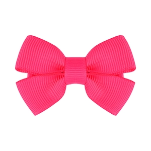 Dettaglio di un fiocco per capelli in nastro grosgrain rosa neon con trama a coste