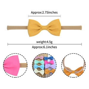 Soft nylon baby headband with 2.75 inch textured knit bow in pink and yellow colors